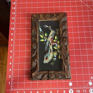 Peacock with wood frame